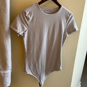 Tan colored Abercrombie and Fitch body suit style t-shirt in excellent condition